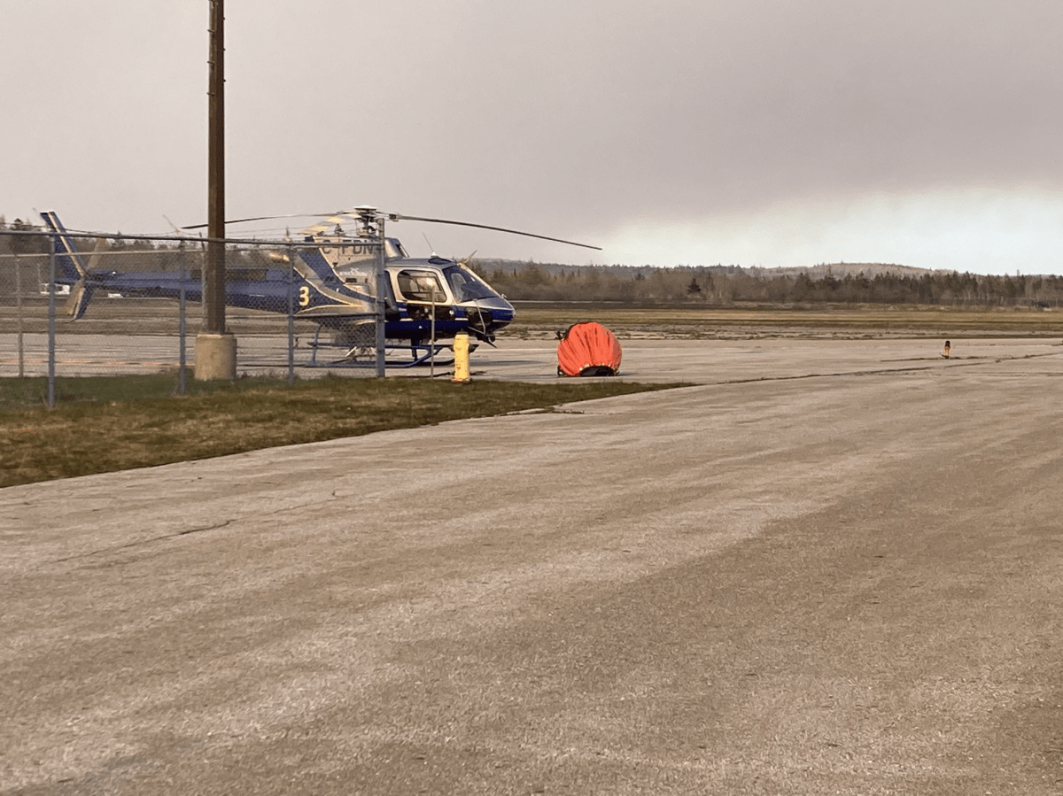 A Department of Natural Resources helicopter fuels up at the Yarmouth airport, about 40 kilometres from Horseshoe Lake, Tuesday.
