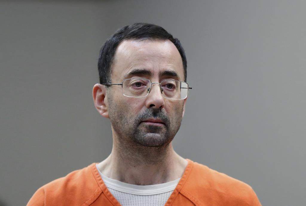 Dr. Larry Nassar, appears in court for a plea hearing on Nov. 22, 2017, in Lansing, Mich. The U.S. Justice Department said Thursday, May 26, 2022 it will not pursue criminal charges against former FBI agents who failed to quickly open an investigation of sports doctor Larry Nassar despite learning in 2015 that he was accused of sexually assaulting female gymnasts.