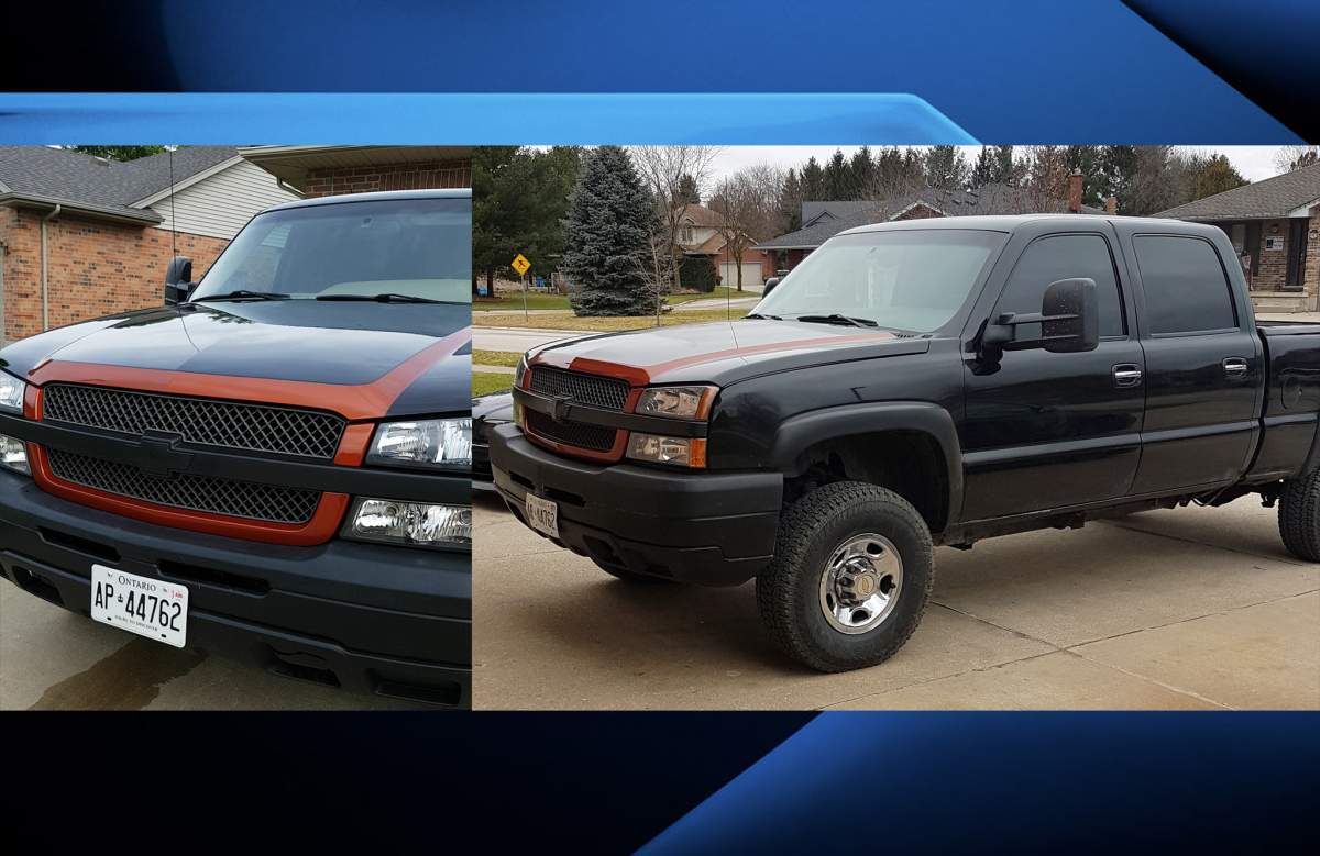 The truck is described as a black 2002 Chevrolet Silverado, with distinct orange trim around the hood and grill. It bears Ontario licence plates AP44762.
