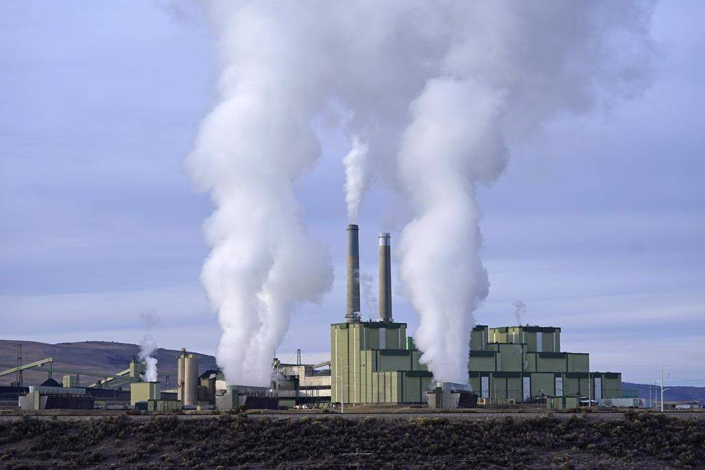 Steam billows from a coal-fired power plant Nov. 18, 2021, in Craig, Colo.