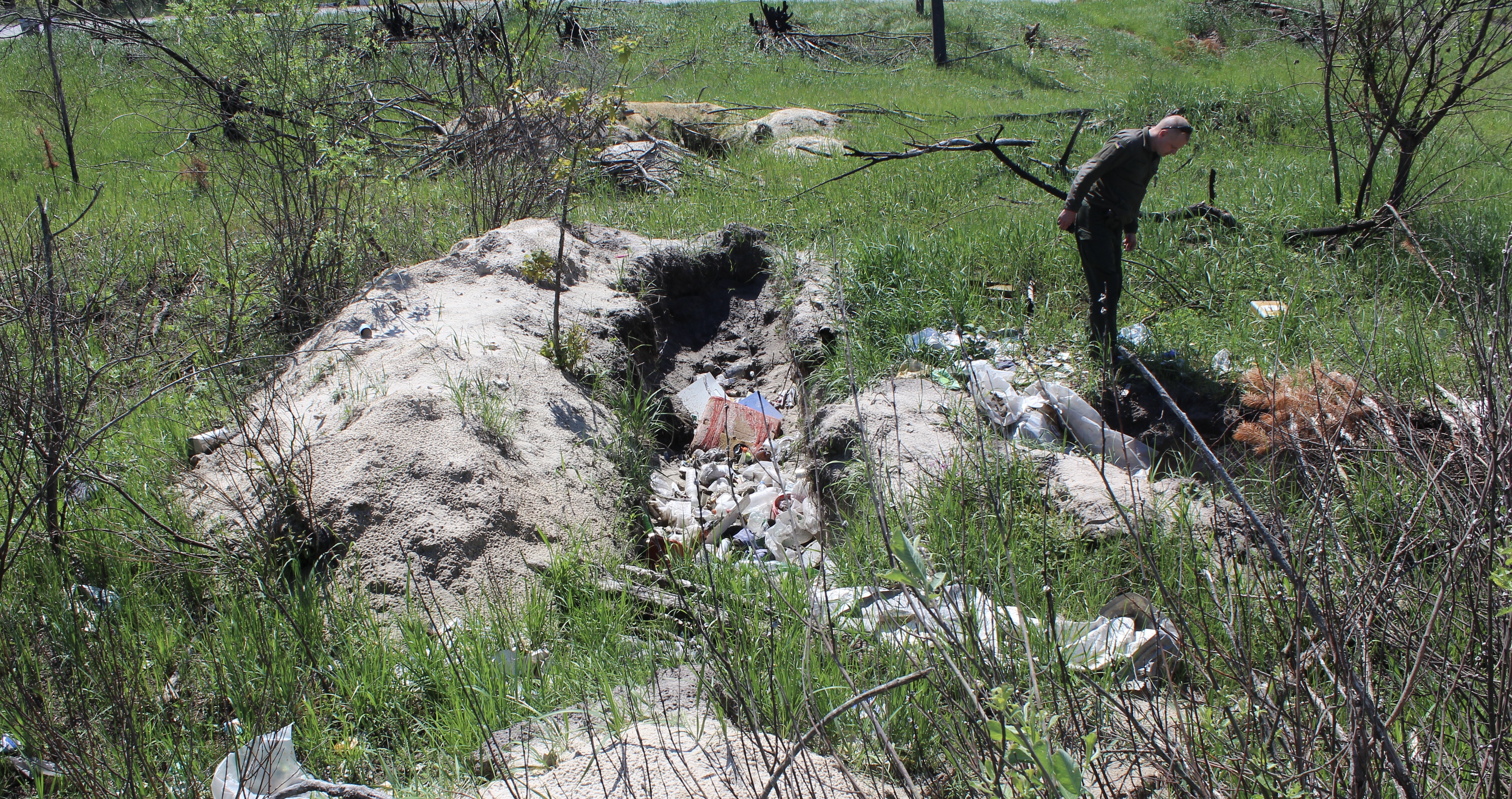 Lt.-Col. Oleksandr Toporovsky of the National Guard of Ukraine inspects an abandoned Russian position in Chornobyl, Ukraine, on June 2, 2022.