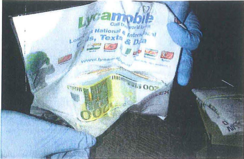 Cash found hidden in a carboard box inside a stereo system in the cabin where Coban was arrested.