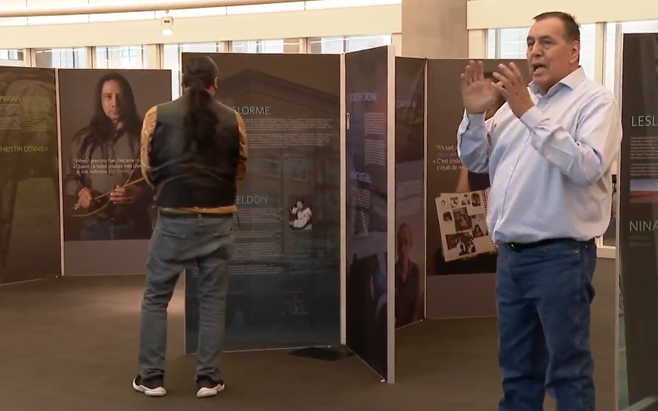Adam North Peigan of the Sixties Scoop Indigenous Society of Alberta speaks at the launch of the group's truth-telling exhibit at the Vancouver Public Library on Sat. June 18, 2022.
