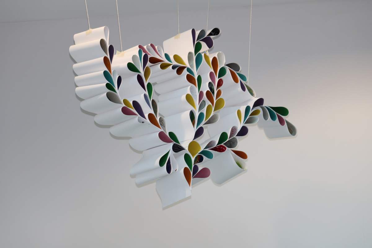 A sculpture by a student at Oakridge Secondary School is a tree made out of folded artwork and letters. June 6, 2022