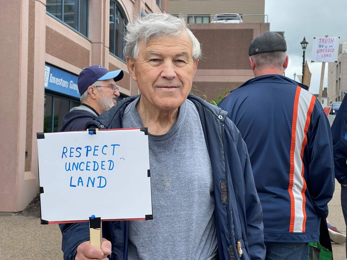 Dave Thompson came to protest with his wife.