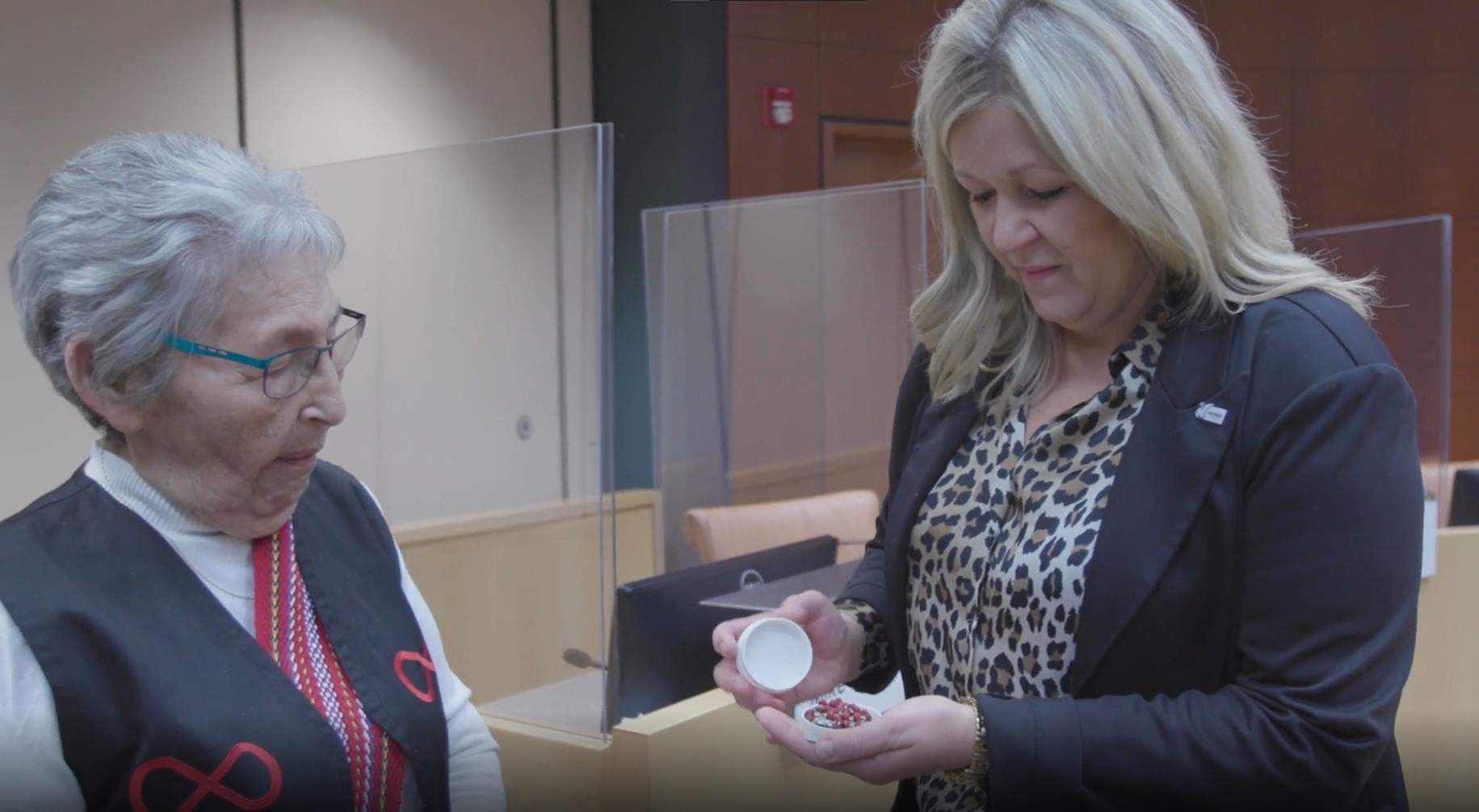Elder Angie Crerar drops off a rosary to Jackie Clayton, mayor of Grande Prairie.