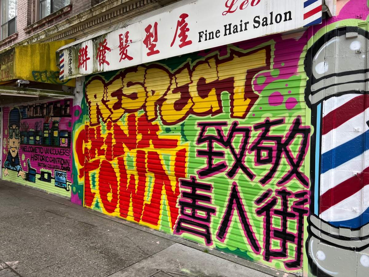 A mural Smokey D and Trey Helten created for the barber shop next to Tommy Wong’s store.
