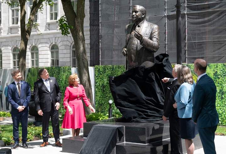 The statue of late Quebec premier Jacques Parizeau is unveiled during a ceremony Wednesday, June 1, 2022 at the legislature in Quebec City. From the left, Quebec Solidaire Leader Gabriel Nadeau-Dubois, Quebec Premier Francois Legault, Lisette Lapointe, wife of Jacques Parizeau, House Speaker Francois Paradis, Quebec Liberal Party representative Christine St-Pierre and Parti Quebecois Leader Joel Arseneau. 