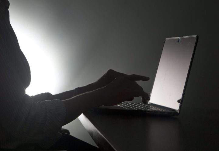 In this, Monday, Dec. 12, 2016, file photo illustration, a person types on a laptop, in Miami.
