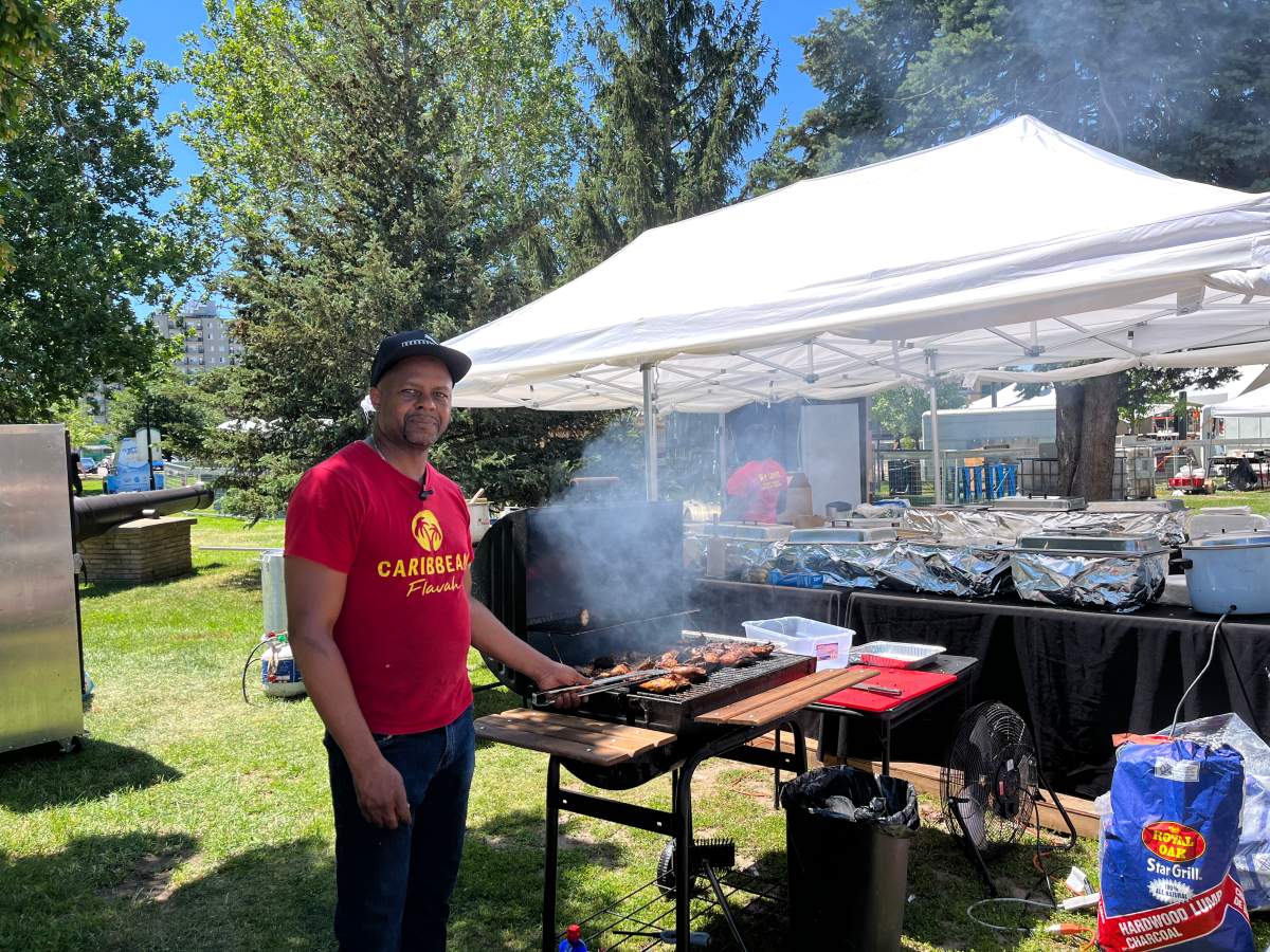 Caribbean Flavah owner Denry George works the barbecue during the London International Food and Drink Festival.