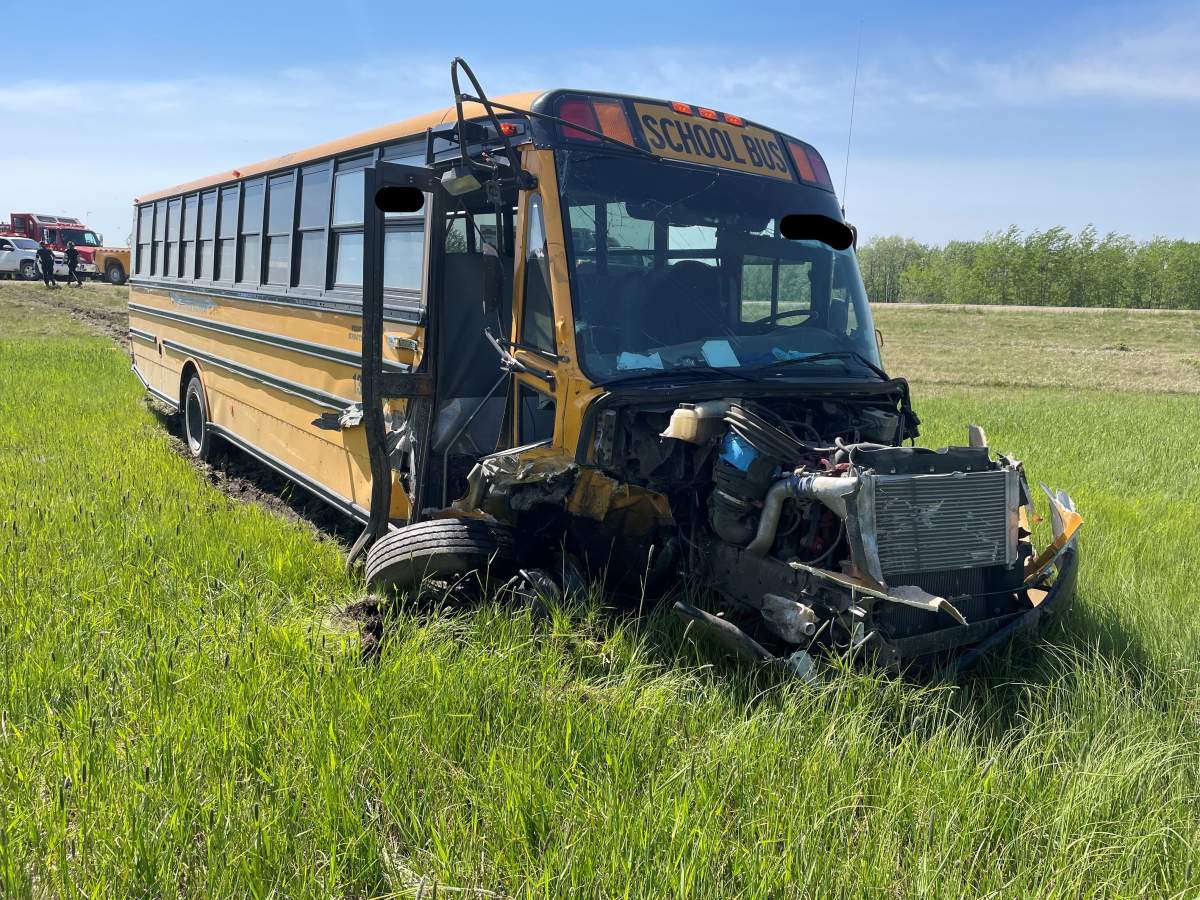 The aftermath of a collision involving a stolen school bus and a construction site west of Edmonton on Highway 43, pictured on June 3, 2022.