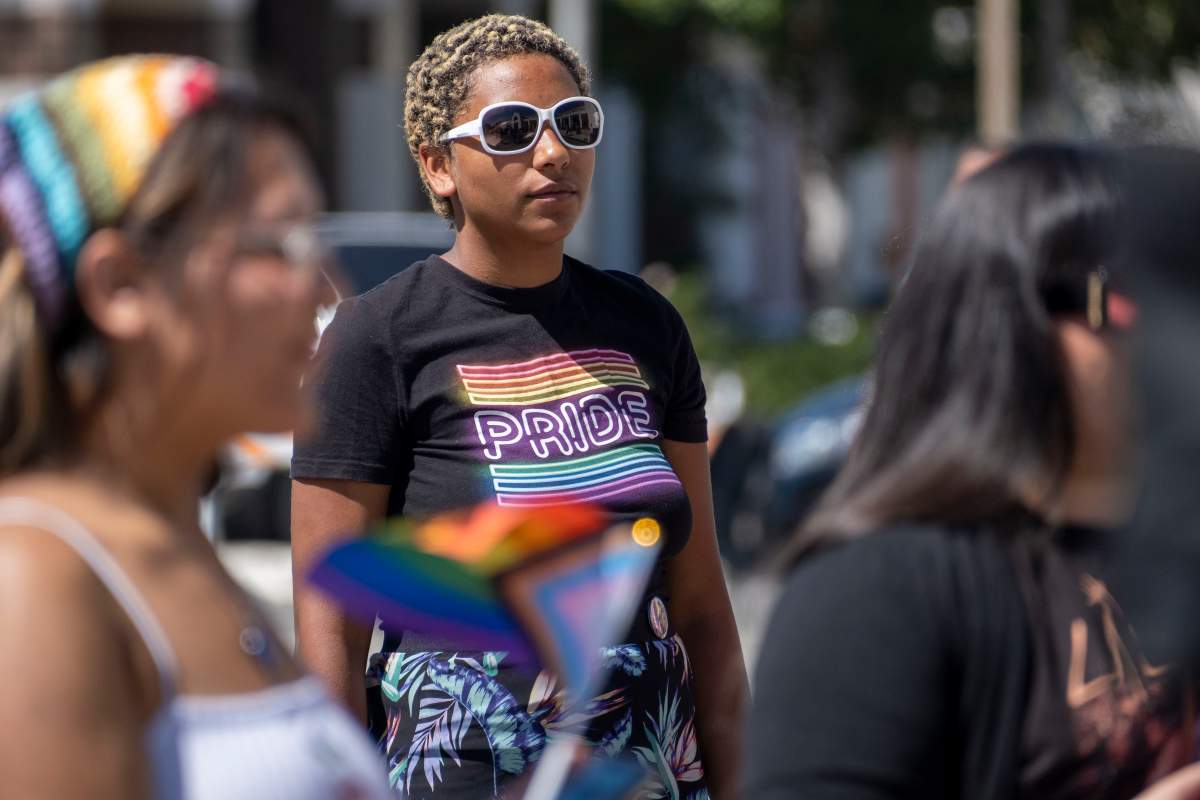 ess Spriggs listens to speakers during a Progressive Pride Flag raising ceremony on the steps of San Fernando City Hall on Wednesday, June 1, 2022. In June 2021, the San Fernando City Council adopted a Resolution declaring June as Lesbian, Gay, Bisexual, Transgender and Queer Pride Month (LGBTQ+) in the City of San Fernando. Progressive Pride Flags will be flown at all City facilities and in the Downtown Mall throughout the month of June 2022 to support Pride Month.