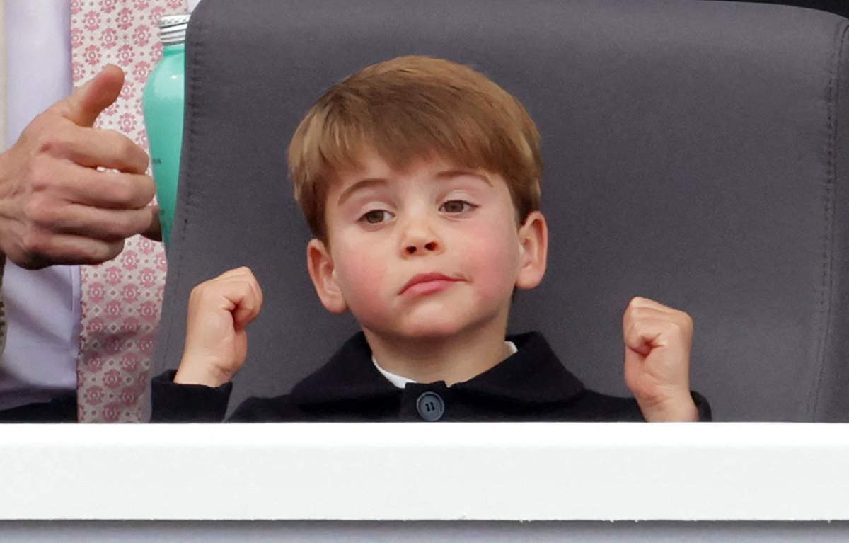 Britain's Prince Louis of Cambridge reacts as he watches the Platinum Pageant in London on June 5, 2022 as part of Queen Elizabeth II's Platinum Jubilee celebrations
