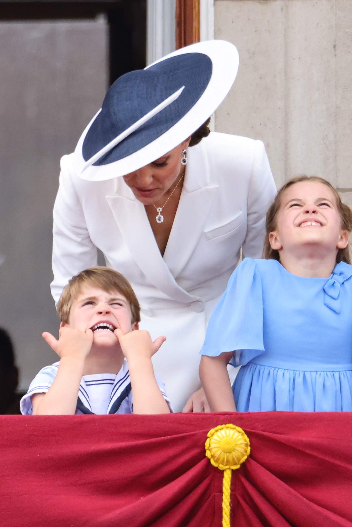 Prince Louis of Cambridge pulls a face as he watches the RAF flypast with Catherine, Duchess of Cambridge and Princess Charlotte of Cambridge from the balcony of Buckingham Palace during the Trooping the Colour parade on June 02, 2022 in London, England.