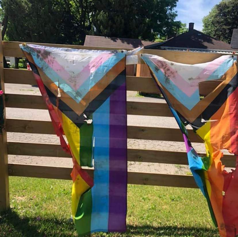 Pride flags outside Indigo Lounge and Wellness Centre in Tillsonburg, Ont., were burned, slashed and discoloured in the early hours on Tuesday, June 14, 2022.