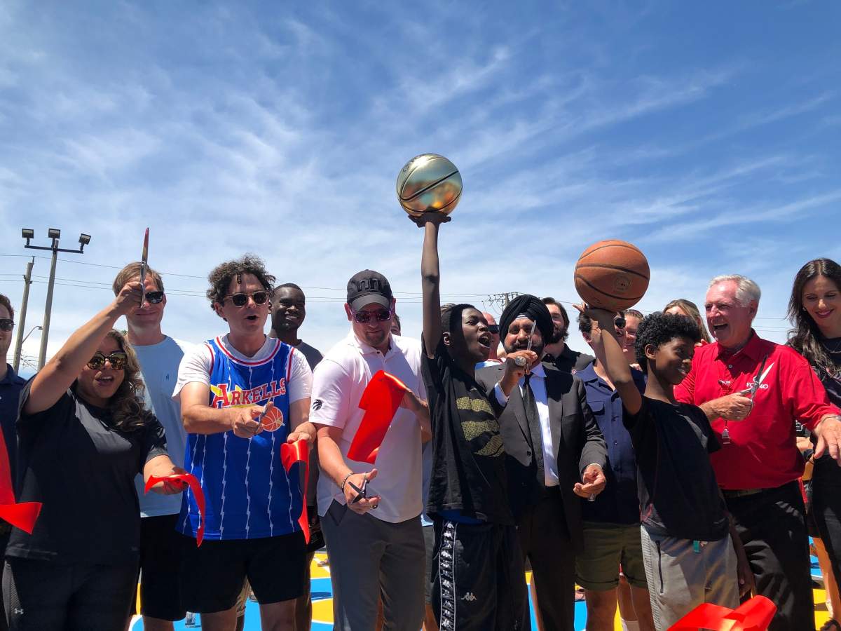 Nrinder Nann, Max Kerman, Nick Nurse, Nav Bhatia, Ron Foxcroft and others from the Hamilton community celebrate moments after cutting the ribbon on the new Rally Court at Woodlands Park.
