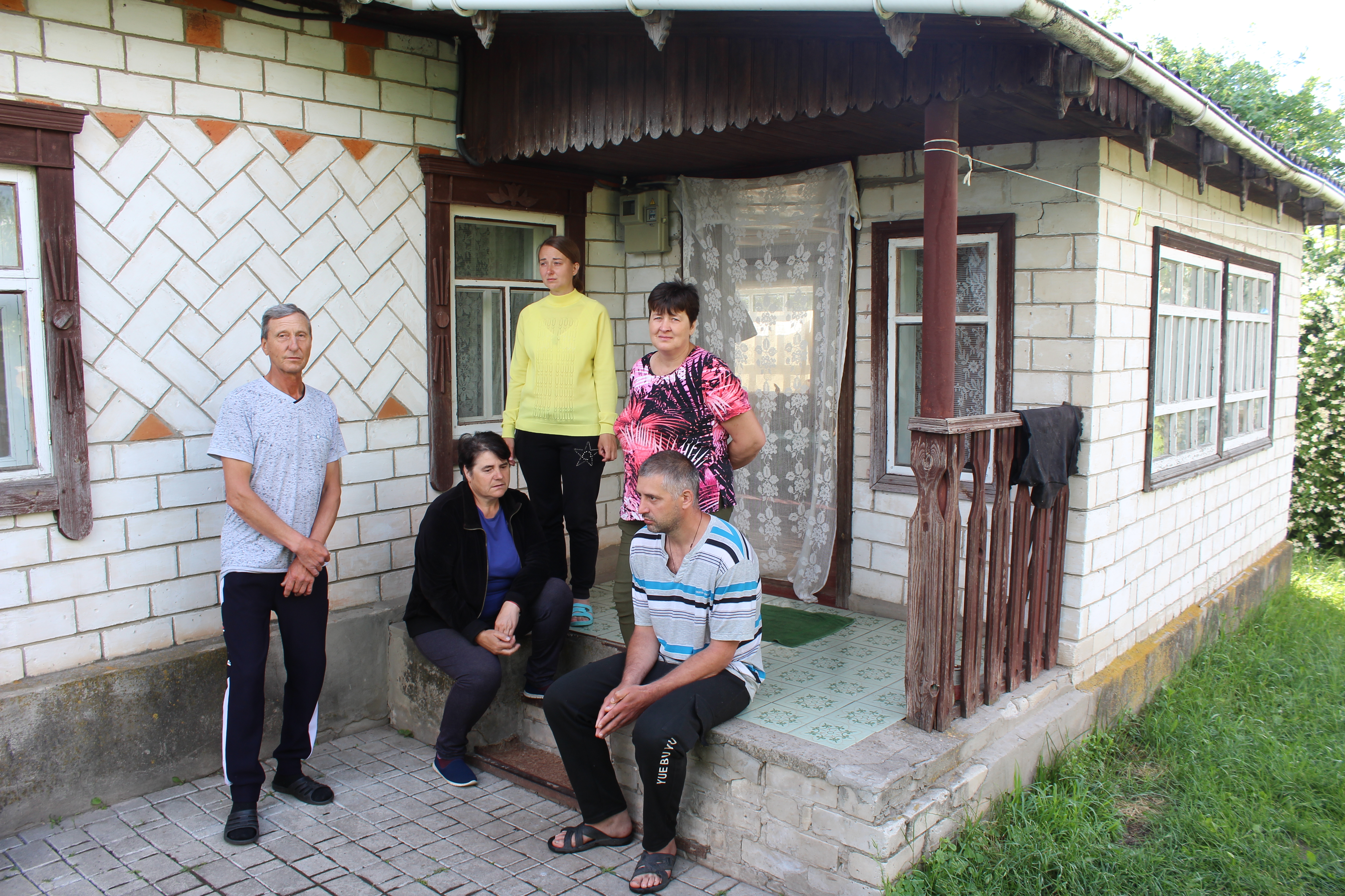 Rita Horbyk’s mother Liudmyla, middle, and father Andrii, right, in Sumy region, Ukraine, June 21, 2022.