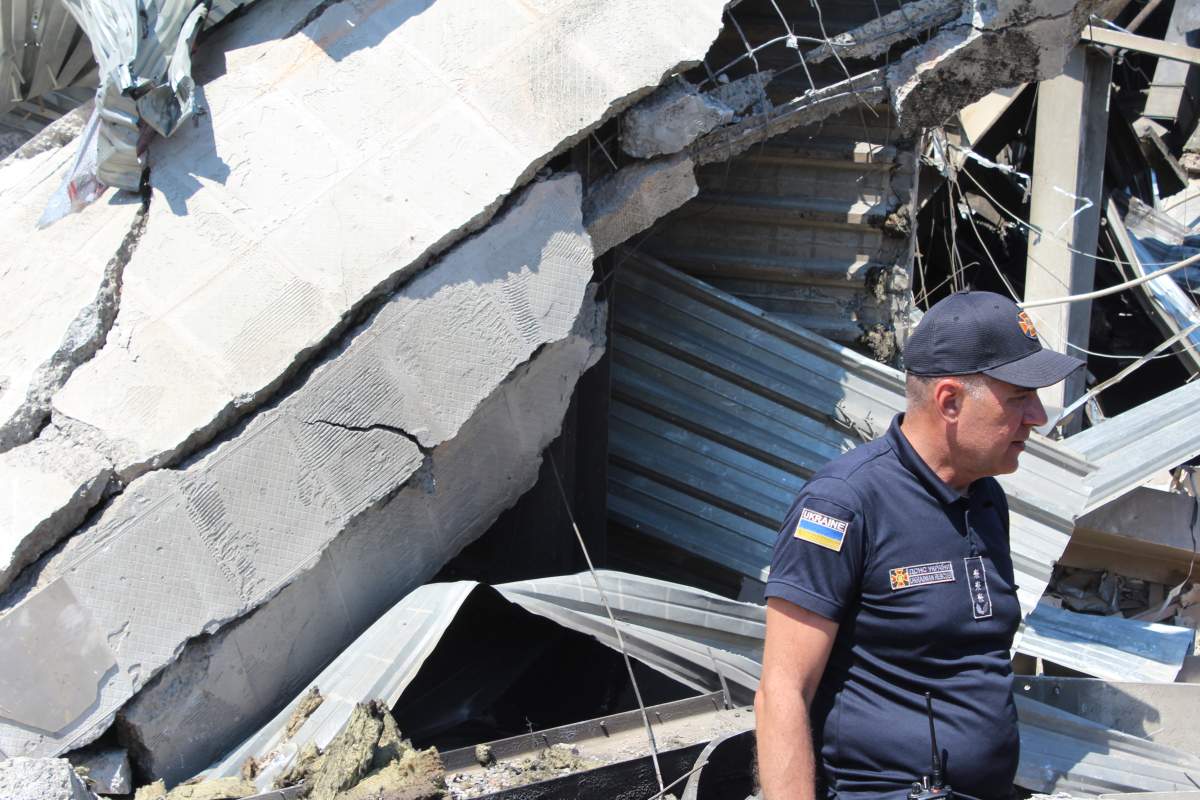 An emergency worker at the scene of a Russian missile strike at a shopping mall in Kremenchuk, Ukraine, on Sunday.