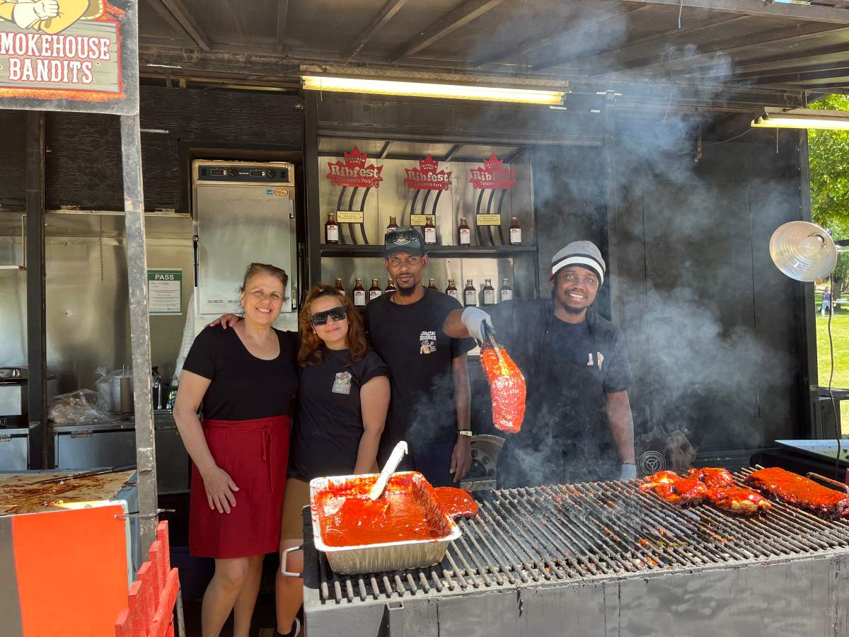 Local barbecue team Jack The Ribber pose for a photo during the first day of the London International Food and Drink Festival.