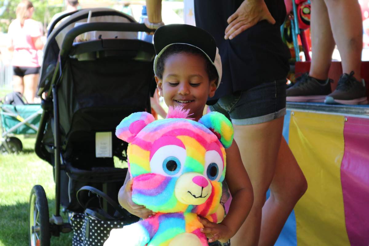 Isaiah Gebredingle holding up his prize at the London Children’s Festival 2022 in Victoria Park on Friday, June 17, 2022