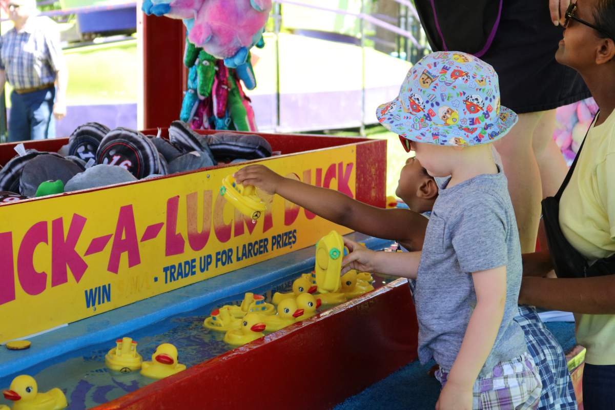 Jayce Fedge left and Isaiah Gebredingle right playing at the duck game at the London Children’s Festival 2022 in Victoria Park on Friday, June 17, 2022