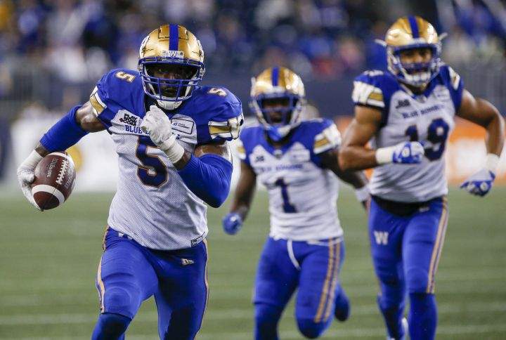 Winnipeg Blue Bombers’ Willie Jefferson (5) runs in his interception for the touchdown against the Hamilton Tiger-Cats during the second half of CFL action in Winnipeg, Friday, June 24, 2022.