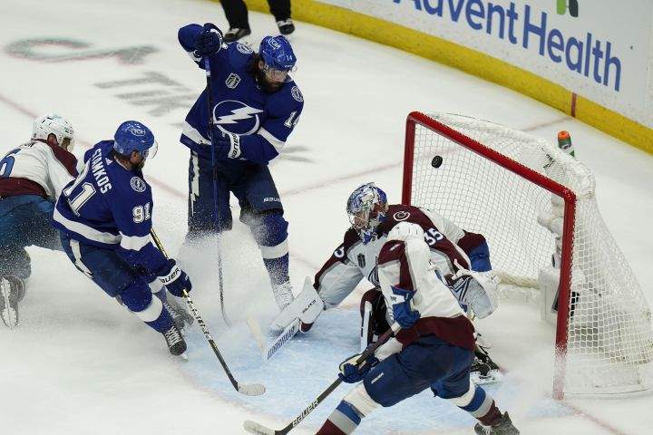 Tampa Bay Lightning left wing Pat Maroon (14) scores past Colorado Avalanche goaltender Darcy Kuemper (35) during the second period of Game 3 of the NHL hockey Stanley Cup Final on Monday, June 20, 2022, in Tampa, Fla.