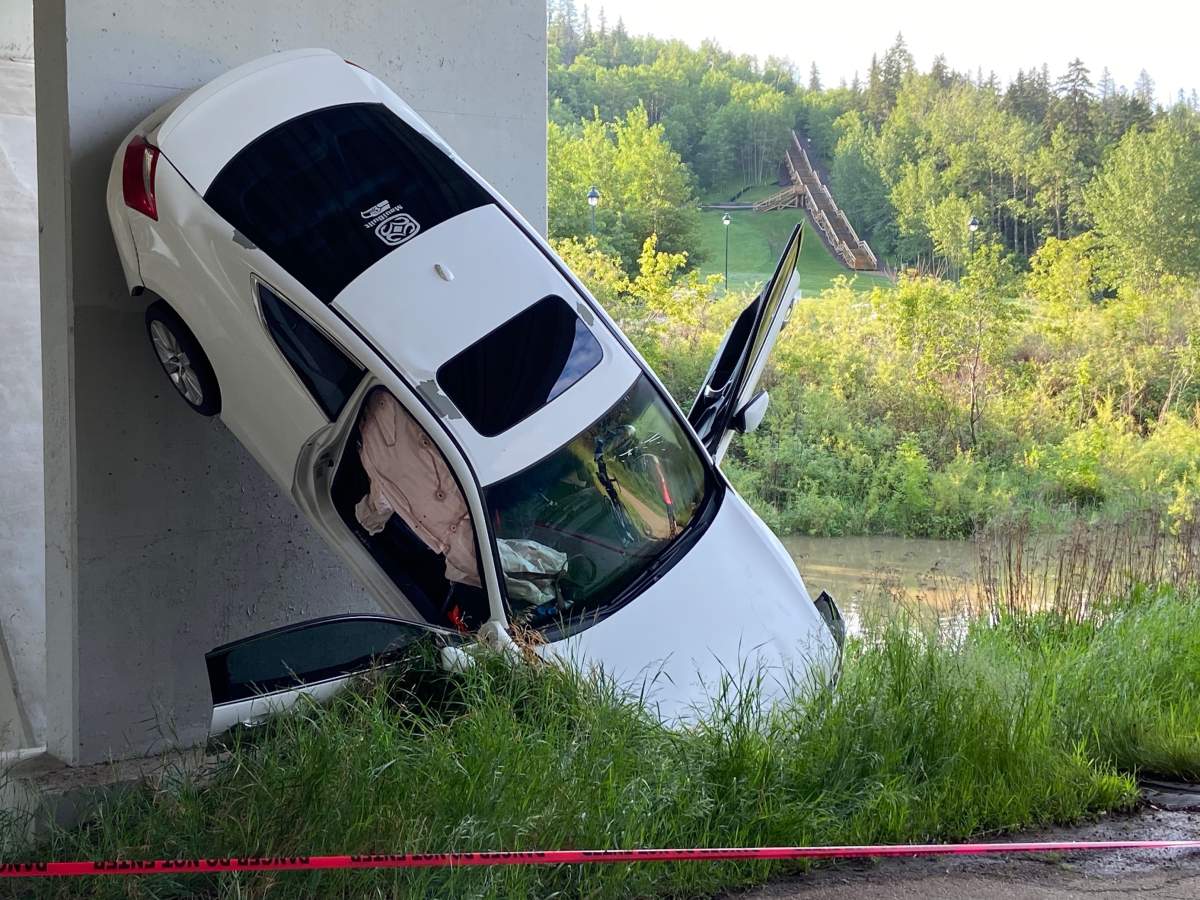 An upside down car under the Campbell bridge on June 16, 2022.