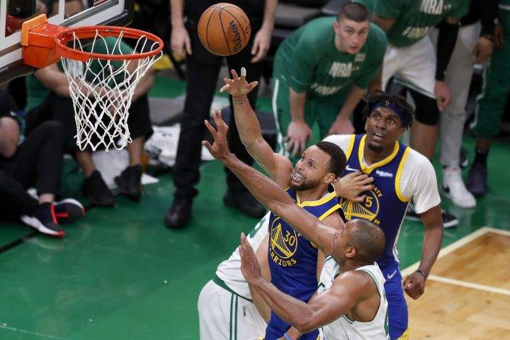 Golden State Warriors guard Stephen Curry (30) puts up a shot against Boston Celtics center Al Horford (42) during the fourth quarter of Game 6 of basketball’s NBA Finals, Thursday, June 16, 2022, in Boston.