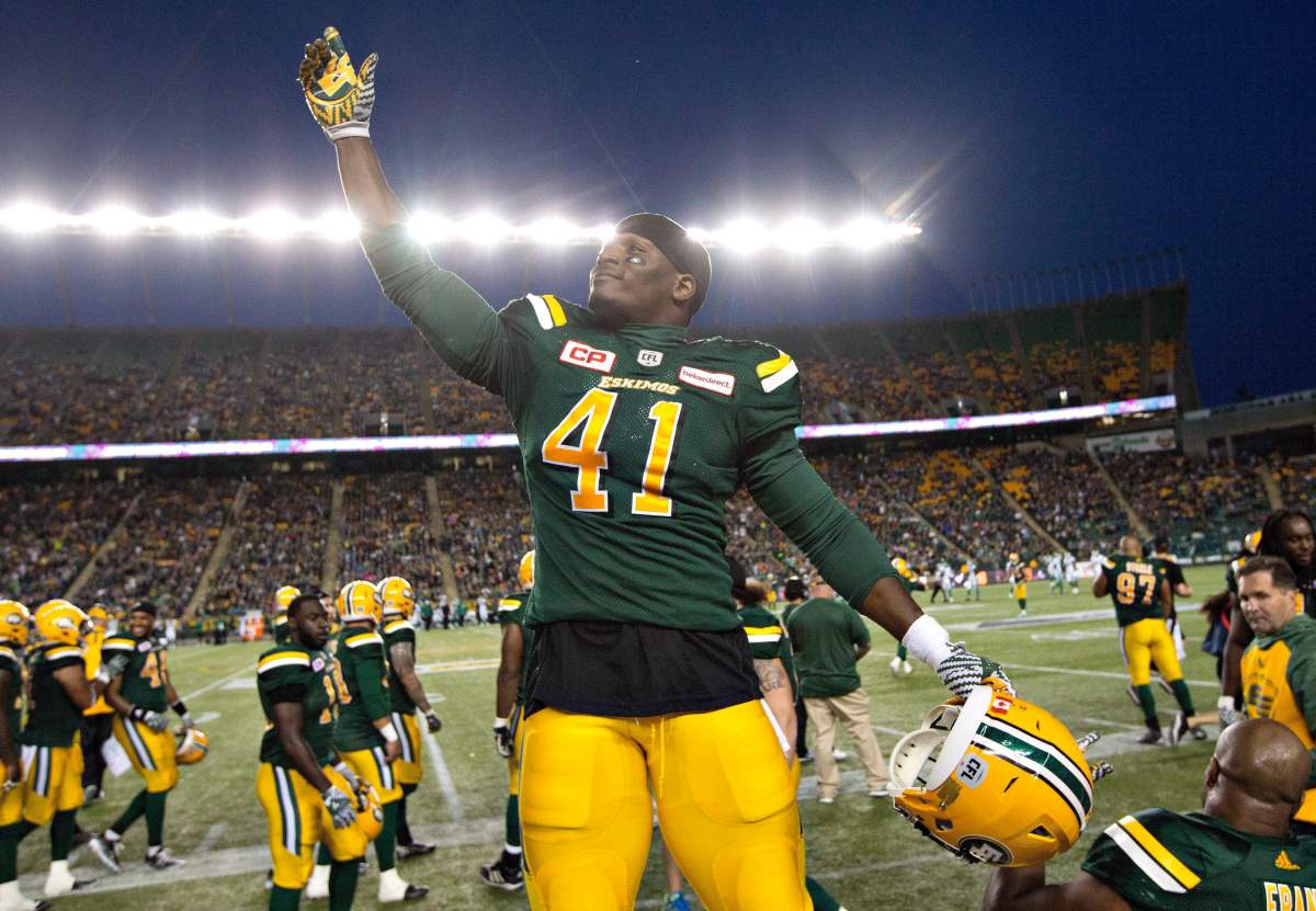 Odell Willis salutes the crowd at Commonwealth Stadium.