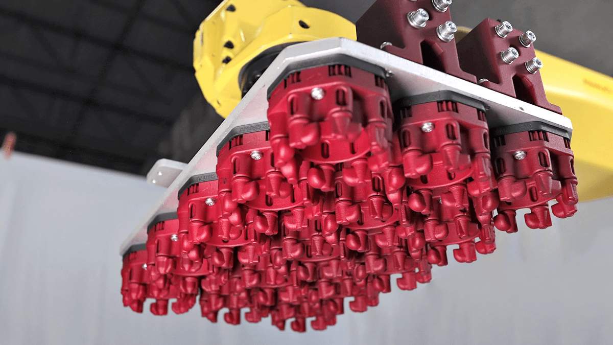 Each of the red plastic octagon-shaped components in this photo are printed by Anubis 3D, and showcase the ability of 3D printers to manufacture multiple interconnected, moving parts simultaneously. All of the internal gears and shafts seen here are able to rotate right out of the machine.