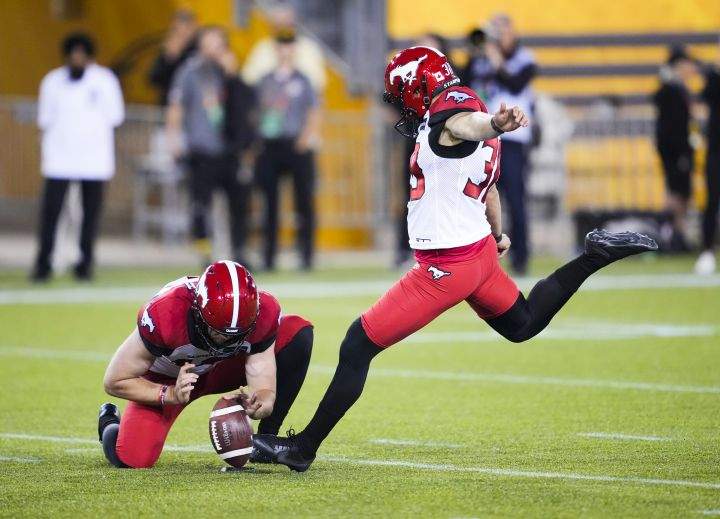 Calgary Stampeders’ Rene Paredes kicks a field goal against the Hamilton Tiger-Cats during the overtime of CFL football action in Hamilton, Ont., Saturday, June 18, 2022.