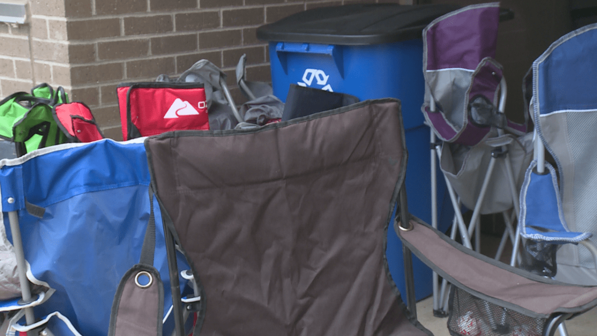 Many people brought camping chairs to sit in while they waited for the passport office to begin accepting people.