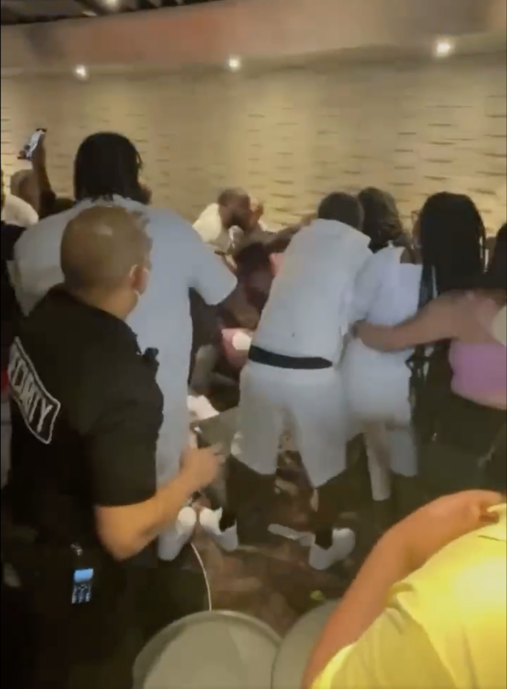 Screenshot of a viral video showing a massive fight that broke out on a Carnival cruise ship early Tuesday morning.