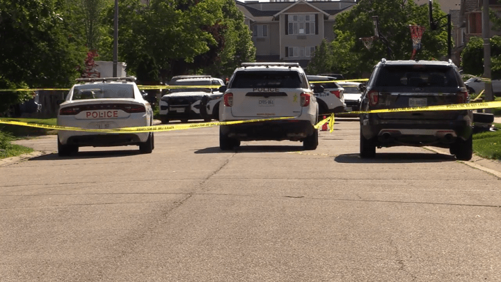 Police at the scene of a shooting in north Whitby Friday morning.