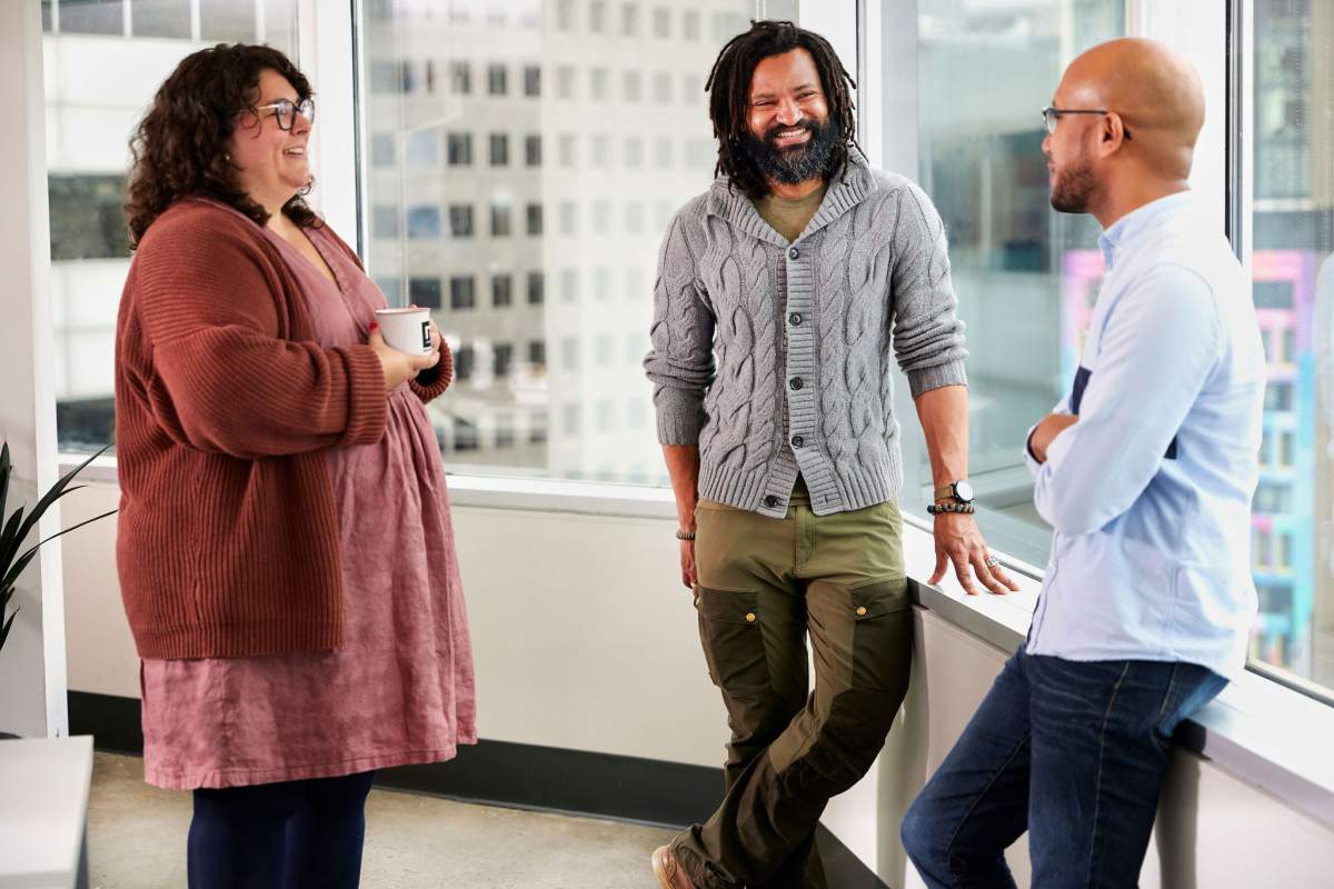 Square Enix Montreal employees chat at work