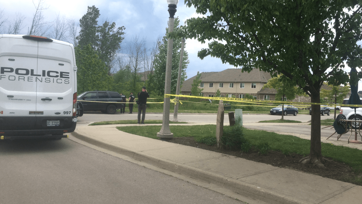 Hamilton Police officers investigate the scene of a shooting in a Stoney Creek, Ont. residential neighbourhood on June 3, 2022.