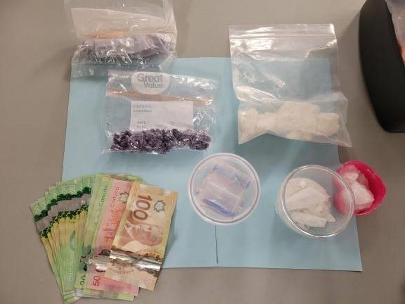 Surrey RCMP seized a handgun, cash and several hundred grams of illicit drugs after finding a stolen vehicle on June 15, 2022.