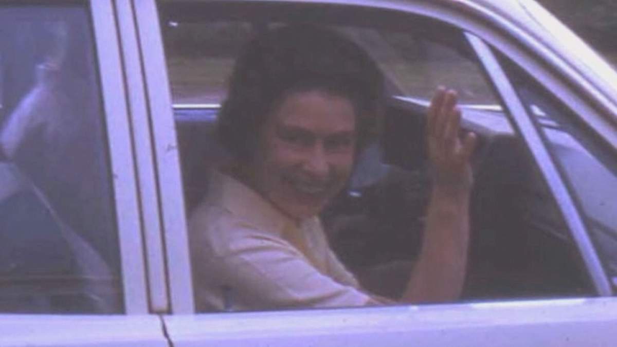 Queen Elizabeth waving farewell to the Baileys.