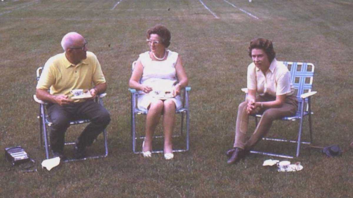 The Queen relaxing in a lawn chair with the Baileys.
