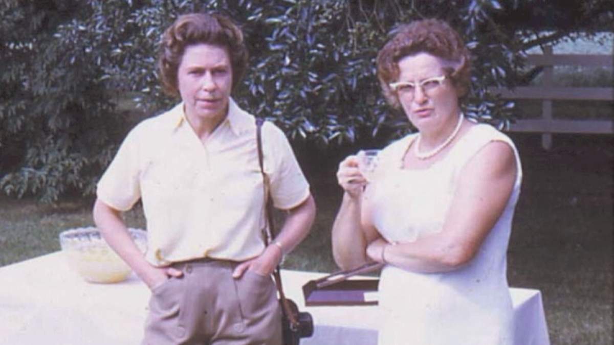 The Queen, with her Nikon camera, and Nora Bailey on the Bailey farm.