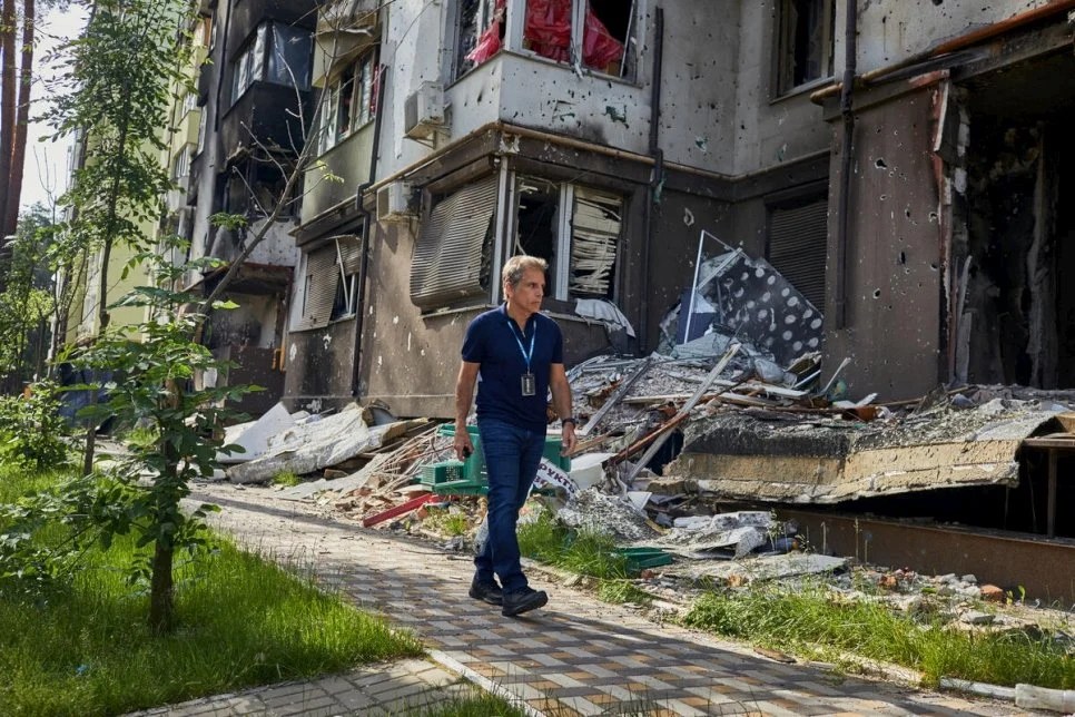 Goodwill Ambassador Ben Stiller is seen walking among destroyed buildings as he visits Lypki, Irpin.