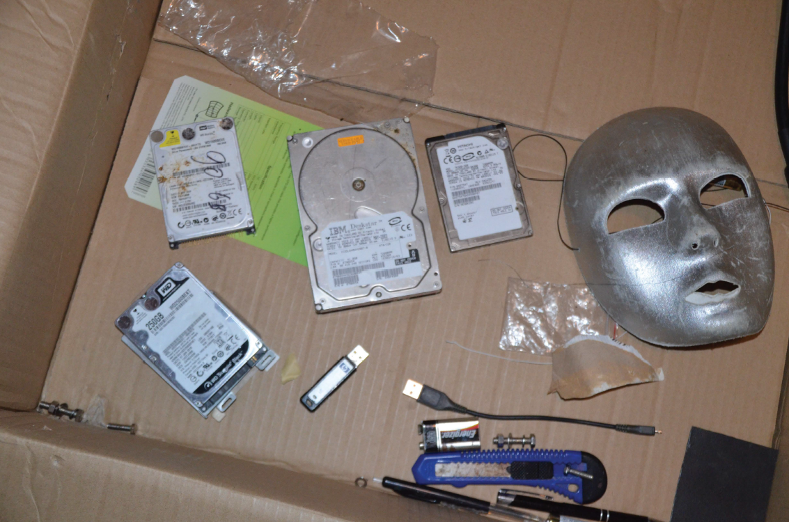 The Hitachi hard drive which Det. Frank van der Molen said he found references to Amanda Todd’s name is seen on the right, adjacent to a silver mask.