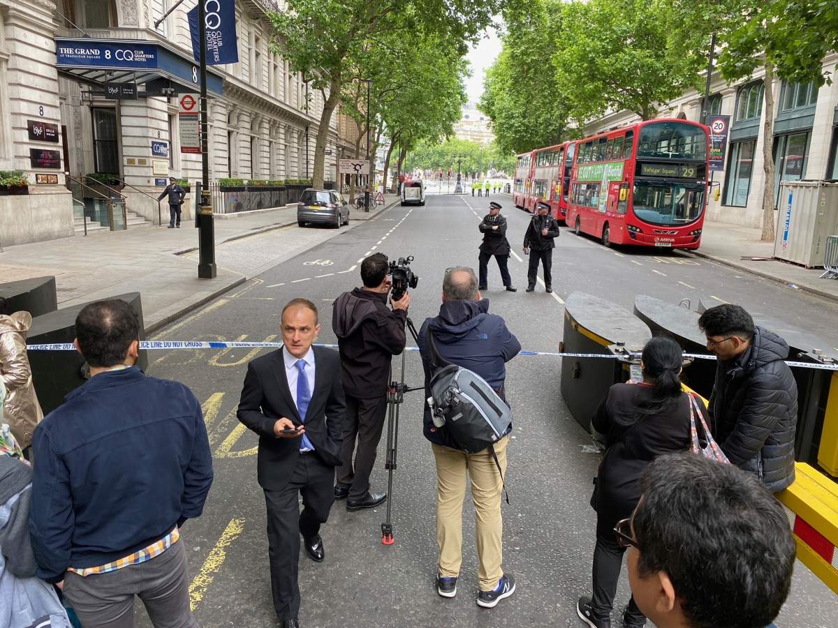 News crews gather near Canada House where a large blast was heard on SAturday morning.