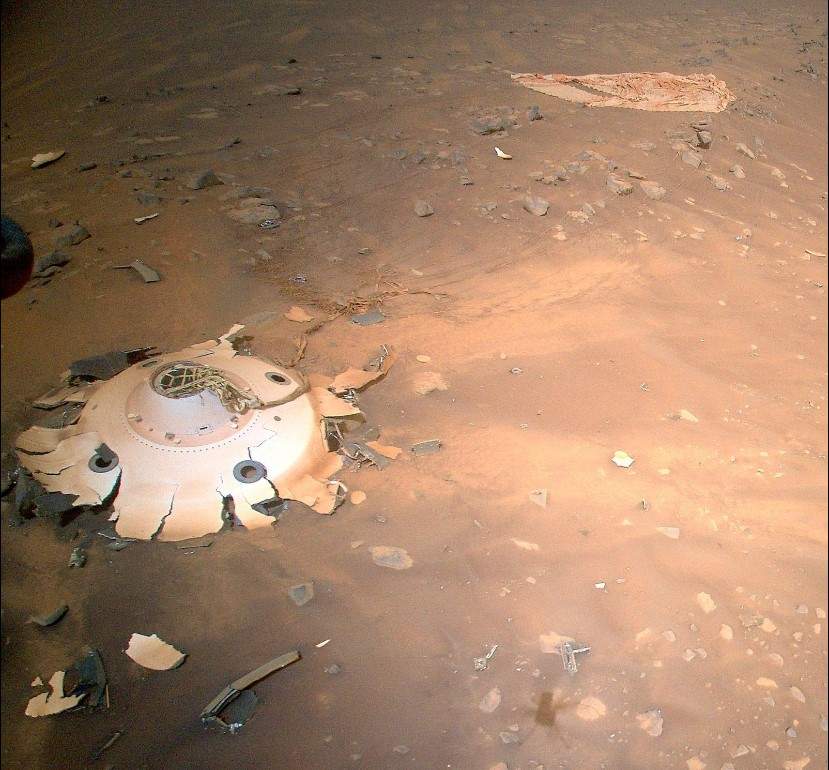 The parachute and cone-shaped backshell of the Perseverance rover, captured by NASA’s Ingenuity helicopter, on April 19, 2022.