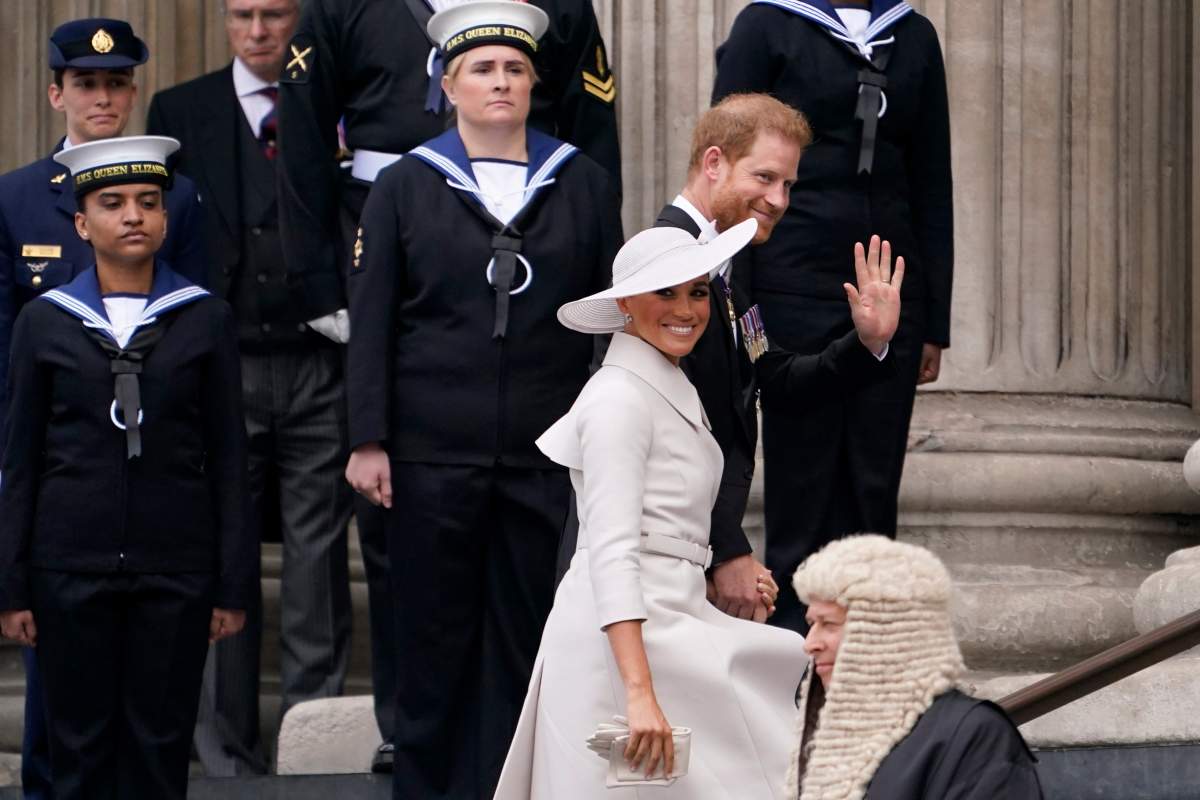 Prince Harry and Meghan Markle ascent the stairs of St. Paul's Cathedral for a Platinum Jubilee service.
