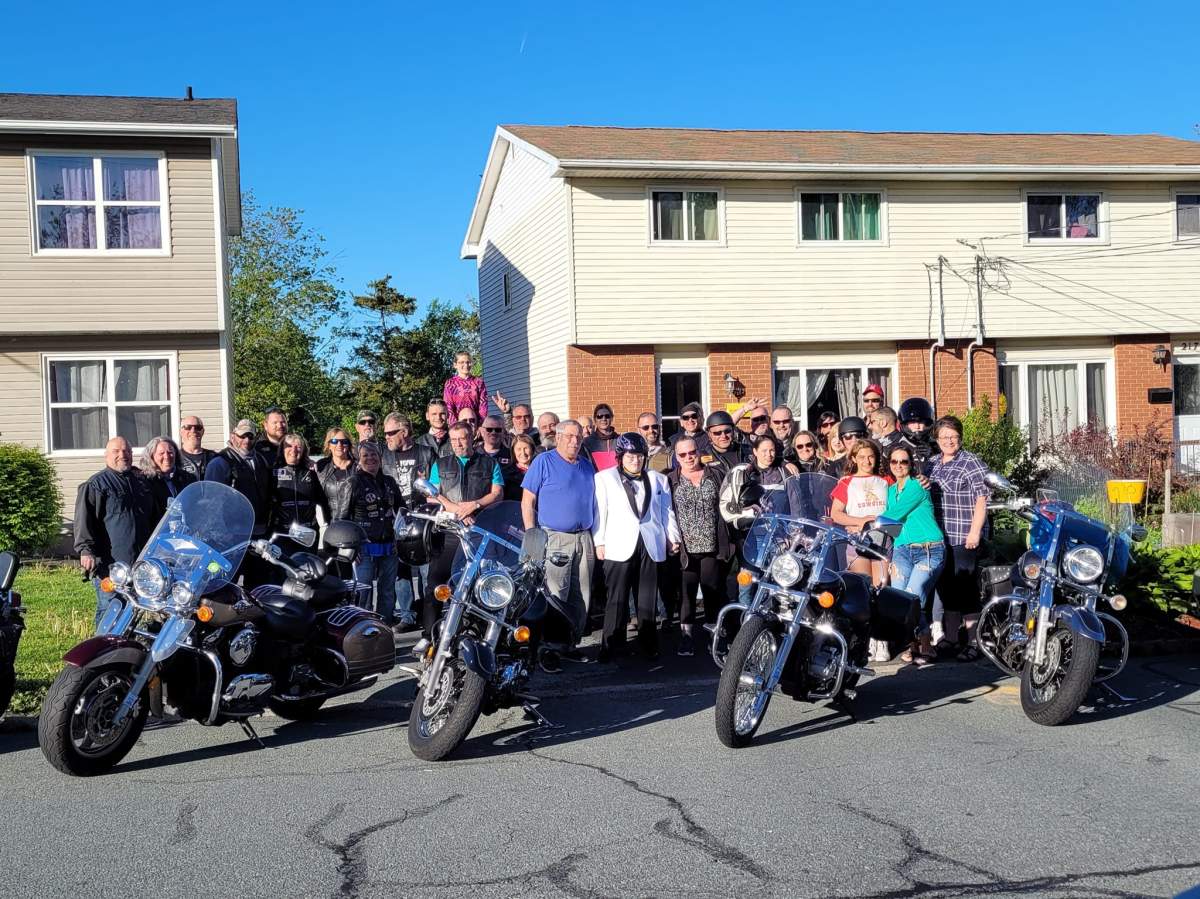 Emily Kinnear, centre, was escorted to prom by nearly 30 motorcycles.