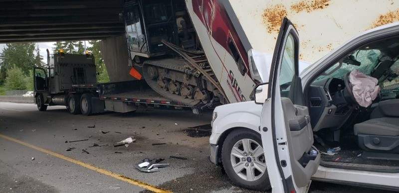 What appears to be a tracked piece of drilling equipment seen after striking a highway overpass in Richmond on June 8, 2022.