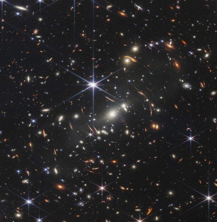 This image provided by NASA on Monday, July 11, 2022, shows galaxy cluster SMACS 0723, captured by the James Webb Space Telescope. The telescope is designed to peer back so far that scientists can get a glimpse of the dawn of the universe about 13.7 billion years ago and zoom in on closer cosmic objects, even our own solar system, with sharper focus. (NASA/ESA/CSA via AP)