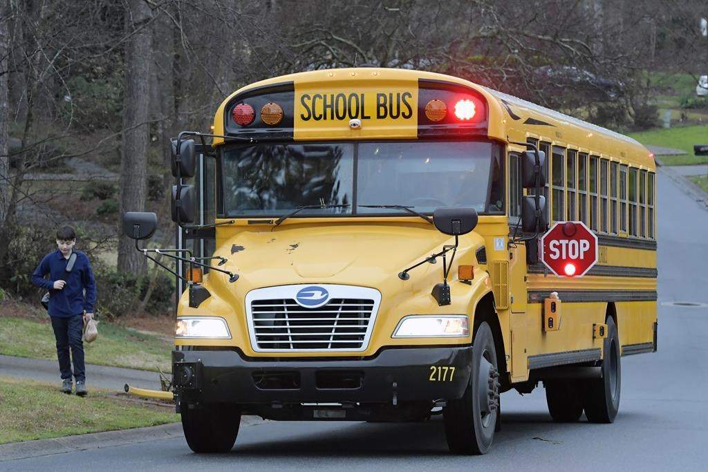 FILE -School Bus stopped on the side of the road. 